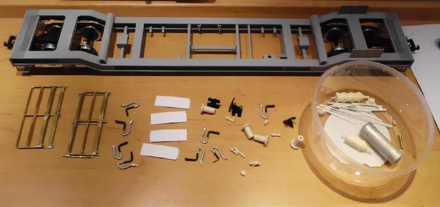 Chassis with grey varnish and raw small parts
